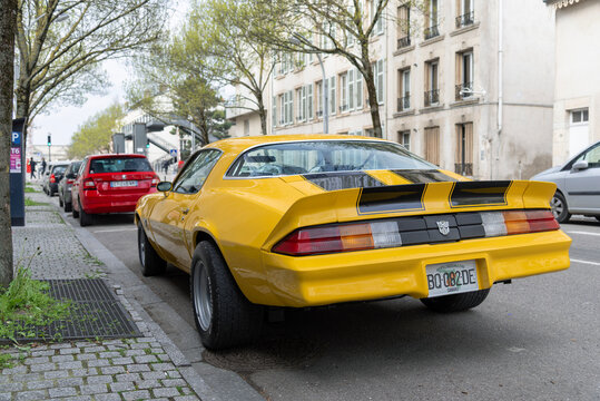 Nancy, France - April 13th 2019 : View on a yellow Chevrolet Camaro parked on a street.