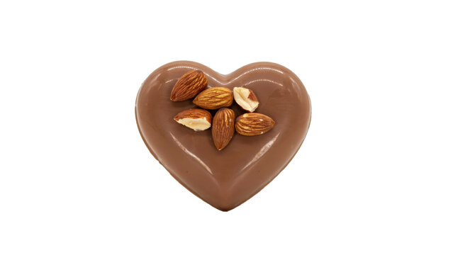 Heart shaped milk chocolate candy topped with whole roasted almonds isolated on a transparent background