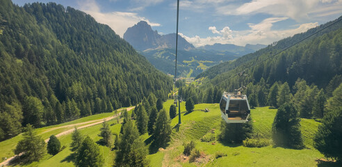 Aerial view from cable car gondola over Alpine valley and pine forest, Seceda, Val Gardena, Dolomites, Italy Stock Photo © Angelov