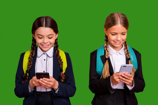 Close up photo two beautiful people she her little ladies funny hands arms telephone reader instagram followers wear formalwear shirt blazer skirt school form bag isolated bright orange background