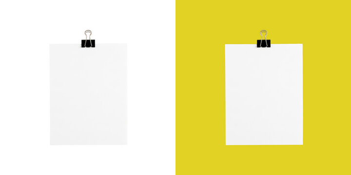 Blank white paper sheets attached with black binder clips on split color display