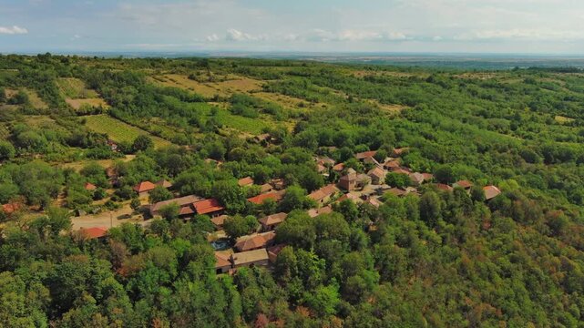 Aerial around view of old rustic vintage houses with wine cellars in Rogljevacke pivnice in Negotin region of Serbia, 4k
