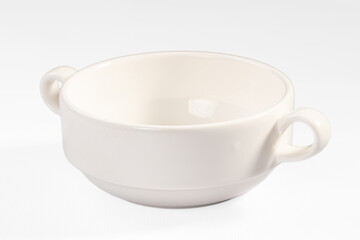 White ceramic soup bowl with two handles on clean background