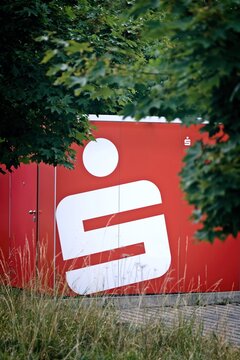 Neu-Ulm, Germany - August, 24, 2026: Closeup of ATM of Sparkasse. Vertical image with selective focus.  	