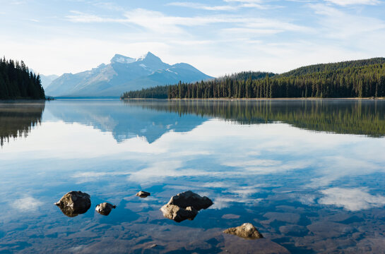 Glassy reflection of mountains in clear lake