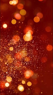 Glowing golden bokeh lights and sparkling glitter particles floating across a rich red orange background, elegant abstract festive scene with warm luminous atmosphere