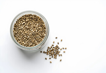 Naklejka premium Superfood nutrition and hemp seeds, organic plant based protein source in a glass jar for healthy diet and vegan lifestyle on a white background