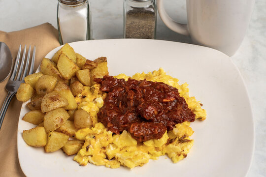 scramble eggs and pulled pork  breakfast