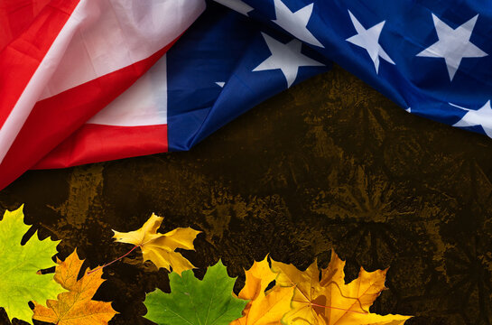 fall leaves sit on on American flag