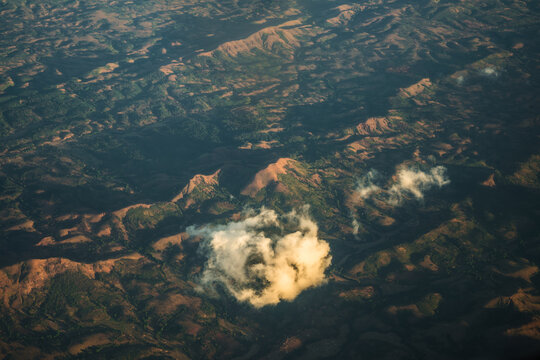 Aerial view of rolling hills and rugged terrain in Madagascar.