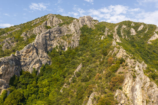 Aerial view of the steep rocky cliffs and lush green forests of Matka Canyon in Skopje, Greater Skopje, North Macedonia.