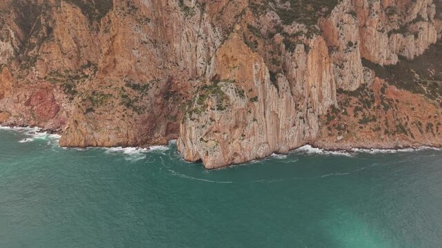 Historic Cliffside Porto Flavia Mining Installation Near Masua In The Sulcis-Iglesiente Region Of Southwestern Sardinia, Italy. Aerial Shot