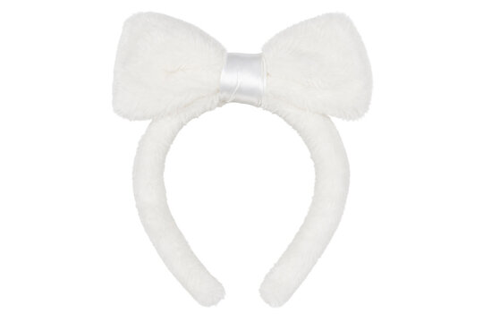 Fluffy white headband with a large, soft bow sits prominently, captured with bright studio lighting against a clean white background