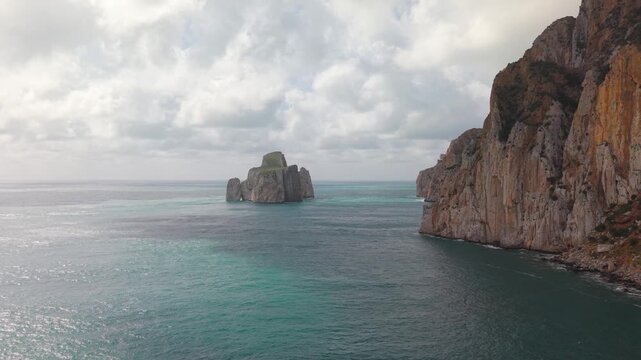 Limestone Sea Stack With Pan di Zucchero Rising From The Mediterranean Near Masua In Sardinia, Italy. Aerial Shot