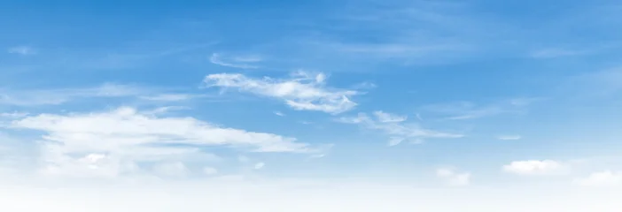 Clear blue sky with wispy clouds drifting above © lovelyday12