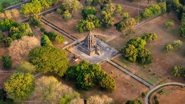 Aerial view of the ancient stone temple surrounded by lush green trees and parkland in Yogyakarta, Special Region of Yogyakarta, Indonesia.