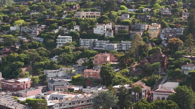 Aerial view of picturesque hillside houses surrounded by lush greenery in Sausalito California.