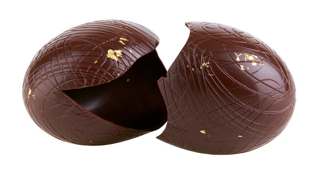 Decorative dark chocolate Easter egg with gold leaf flakes cracked open, isolated on transparent background