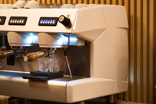 Espresso machine preparing fresh coffee in cafe kitchen