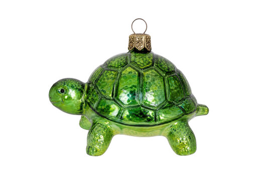 Vibrant green glass turtle Christmas ornament with a textured shell and a golden cap, isolated on a clean white background