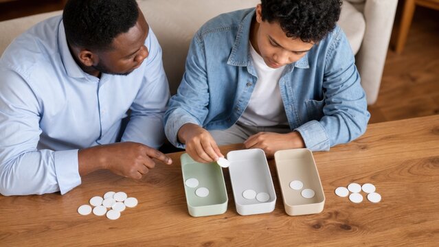 Young worker first paycheck planning: A mentor and young worker allocate blank tokens among savings, transport and living-cost trays
