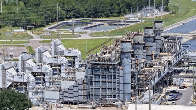 Aerial view of FPL Sanford Power Plant showing industrial structures, smokestacks, and complex piping systems in DeBary, Florida, United States.