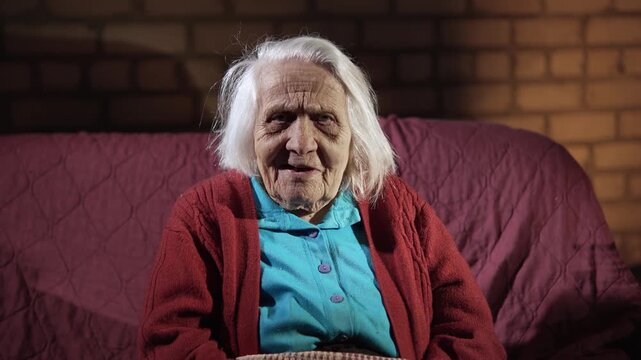 An elderly woman face expresses various emotions as she looks at the camera