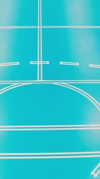 Empty cyan futsal court with white markings