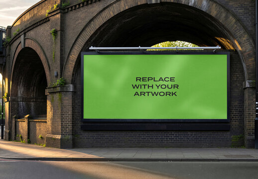 Large vertical billboard mockup with screen and placeholder text mounted on a brick bridge structure in an urban outdoor setting, Template, design
