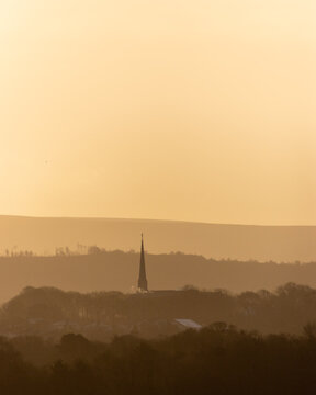 Distant rolling hills landscape under hazy sky