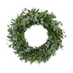 Beautiful round Christmas wreath made of fresh green eucalyptus and fir branches, isolated on a clean white background © Chinases