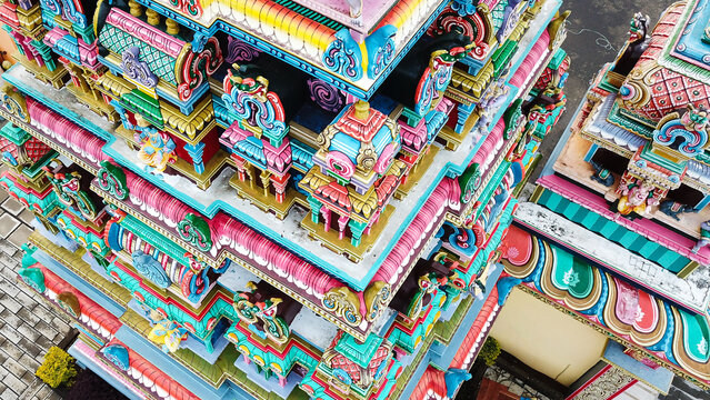 Aerial view of the colorful Hindu temple featuring intricate architectural details and vibrant sculptures in Grand Gaube, Riviere du Rempart, Mauritius.