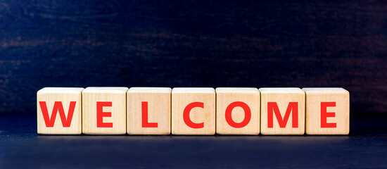 Welcome word symbol. Concept word Welcome on beautiful wooden blocks. Beautiful black table black background. Business welcome word concept. Copy space. © Dzmitry