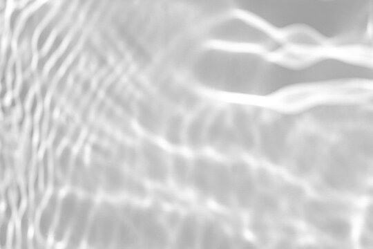 Real fluid caustic ripple shadow cut out on a transparent png background with soft wavy edges. Drops into a serene wellness mockup overlay, an abstract and surreal composition as a png overlay.