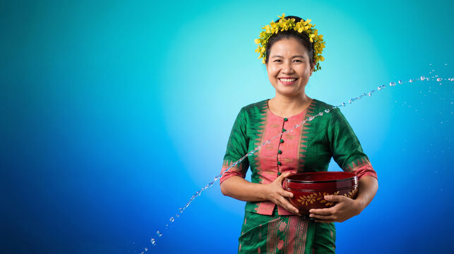 Thingyan Myanmar portrait with padauk blossoms and water motion