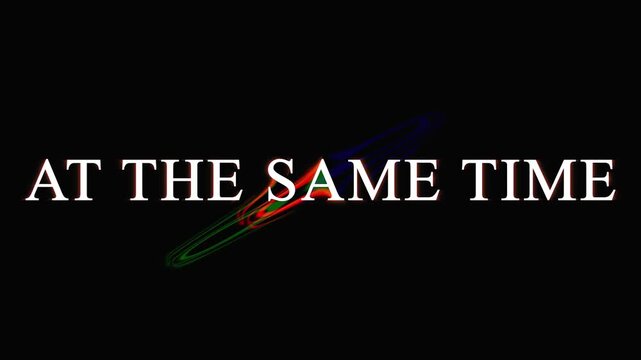 Abstract neon light streaks forming words AT THE SAME TIME in darkness with subtle motion