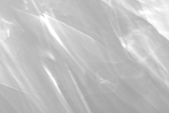 Real broad caustic ripple shadow cut out on a transparent png background with soft overlapping translucent bands. Drops into an airy poster design overlay, a serene beauty poster and album cover.
