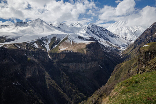Snow covered mountains under blue sky