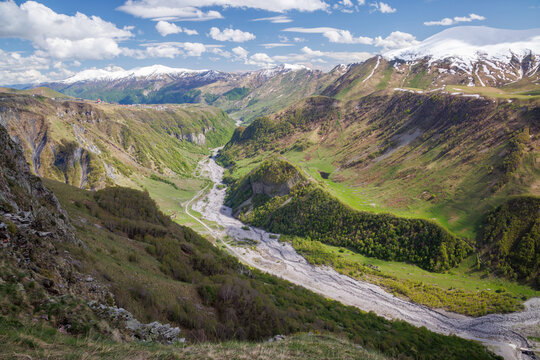 Mountain valley with river and green slopes