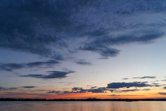 Dramatic twilight sky over river horizon