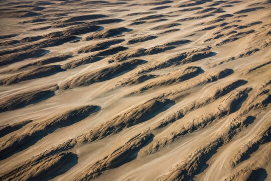 Yardang ridges carved parallel by wind across a desert floor