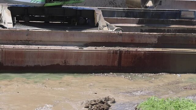 Rotary Clamshell Grab Bucket at Crane Excavator Barge River Coast Cleaning
