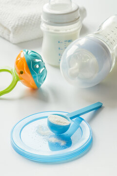 preparation of mixture baby feeding on white background