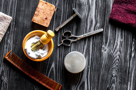 Tools for cutting beard barbershop top view on wooden background