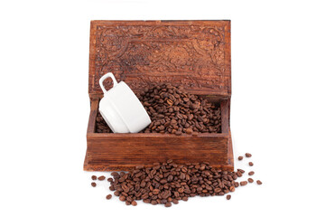 Roasted coffee beans and a cup in a wooden box. © kuzina1964