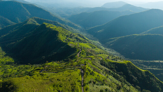 Aerial view of the winding road at Obudu Mountain Resort surrounded by lush green mountain ridges in Obudu, Cross River, Nigeria.