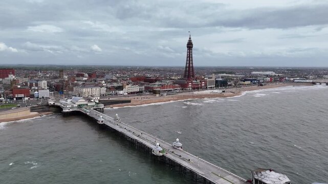 Aerial drone view of blackpool north pier and tower overlooking irish sea in northwest england.