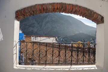 View of the moutains through a patio window, in the medina in Chefchaouen, Morocco © Angela