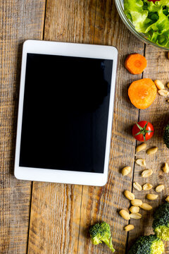 concept diet and tablet with vegetables mock up