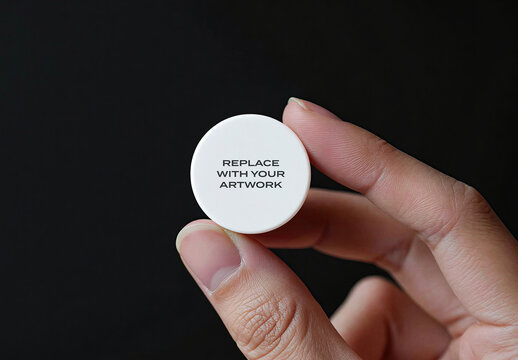 Circular product packaging mockup held between fingers against black background for branding and graphic design presentation, minimalist studio display with clean surface detailed texture